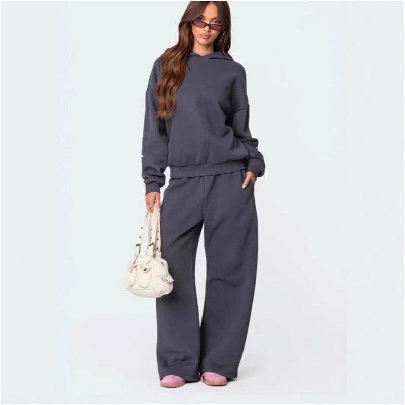 Fleece Hooded Bow Print Sweatsuit worn by a model, showcasing cozy style and coordinated gray pieces.