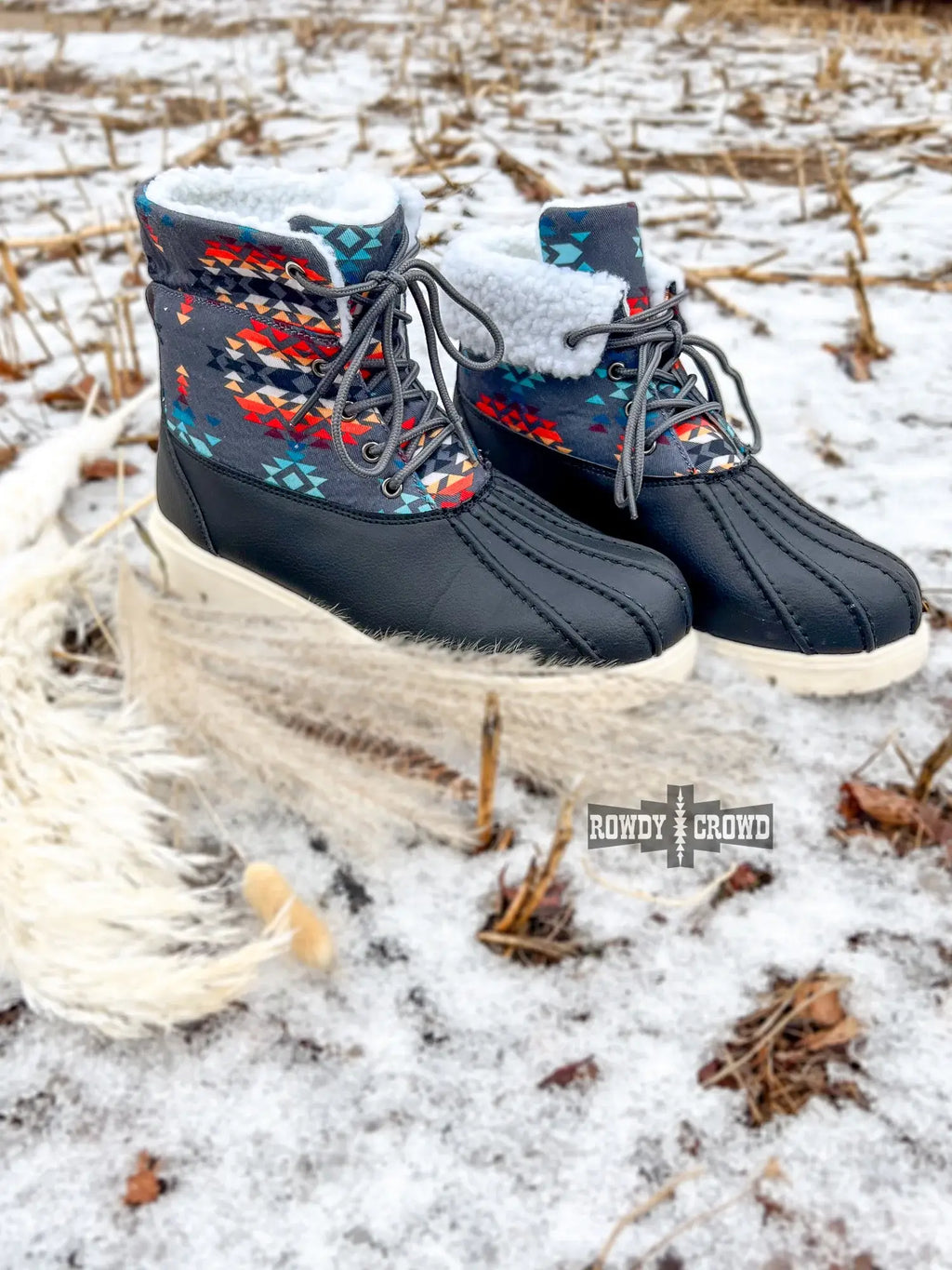 Down Canyon Duck Boots in black with gray Aztec pattern, featuring white fur lining, ideal for wet weather.