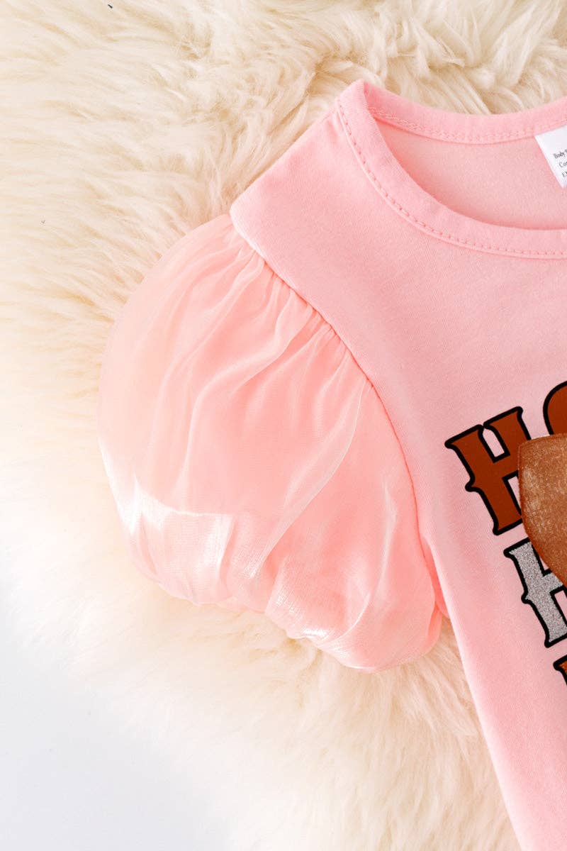 Howdy Howdy" Pink tee and denim shorts.