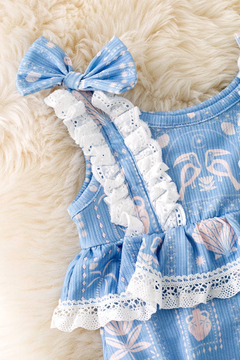 White seashell on blue baby bodysuit w/snaps.