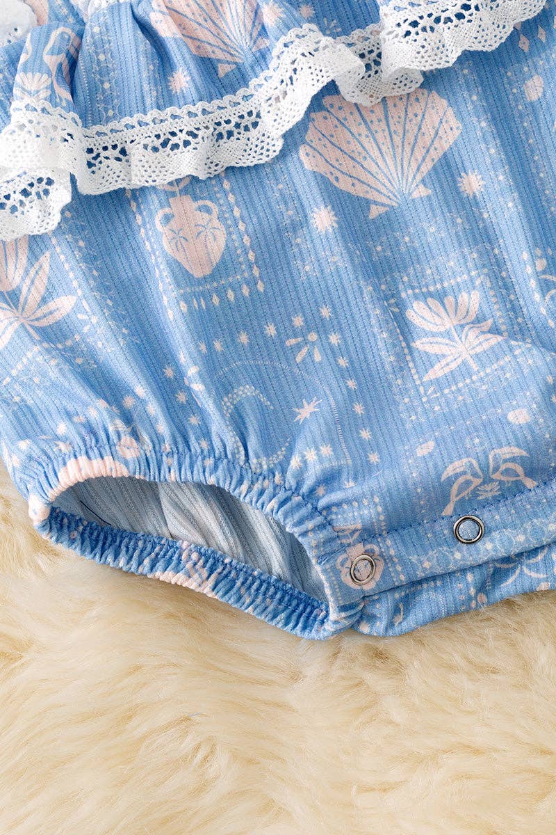 White seashell on blue baby bodysuit w/snaps.