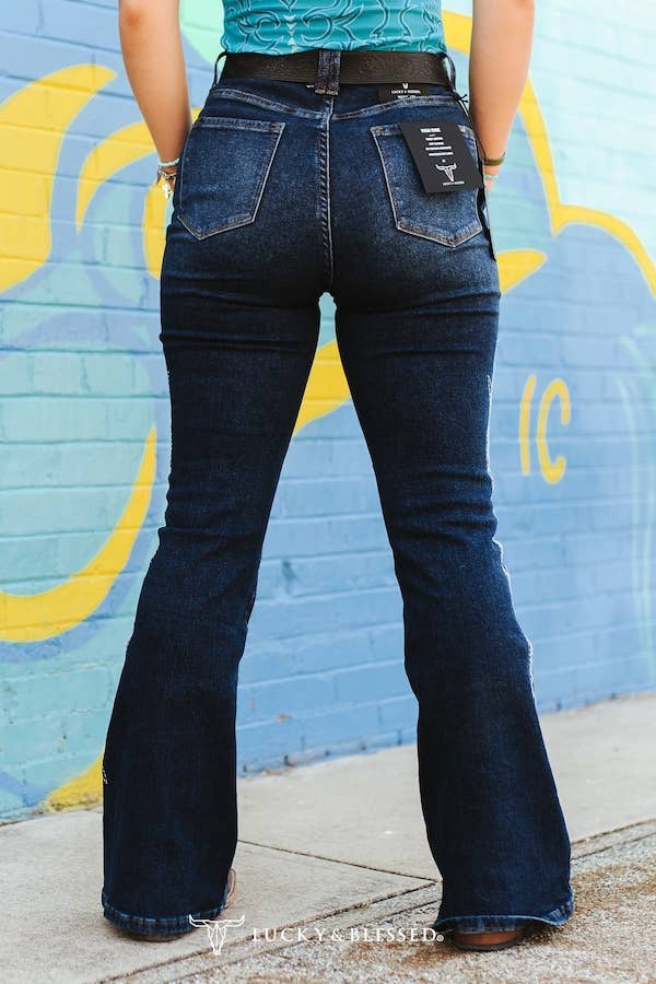 Plus Dark Wash Tummy Control Boot Stitch Embroidery Jeans with a flattering fit and flare style from the back.