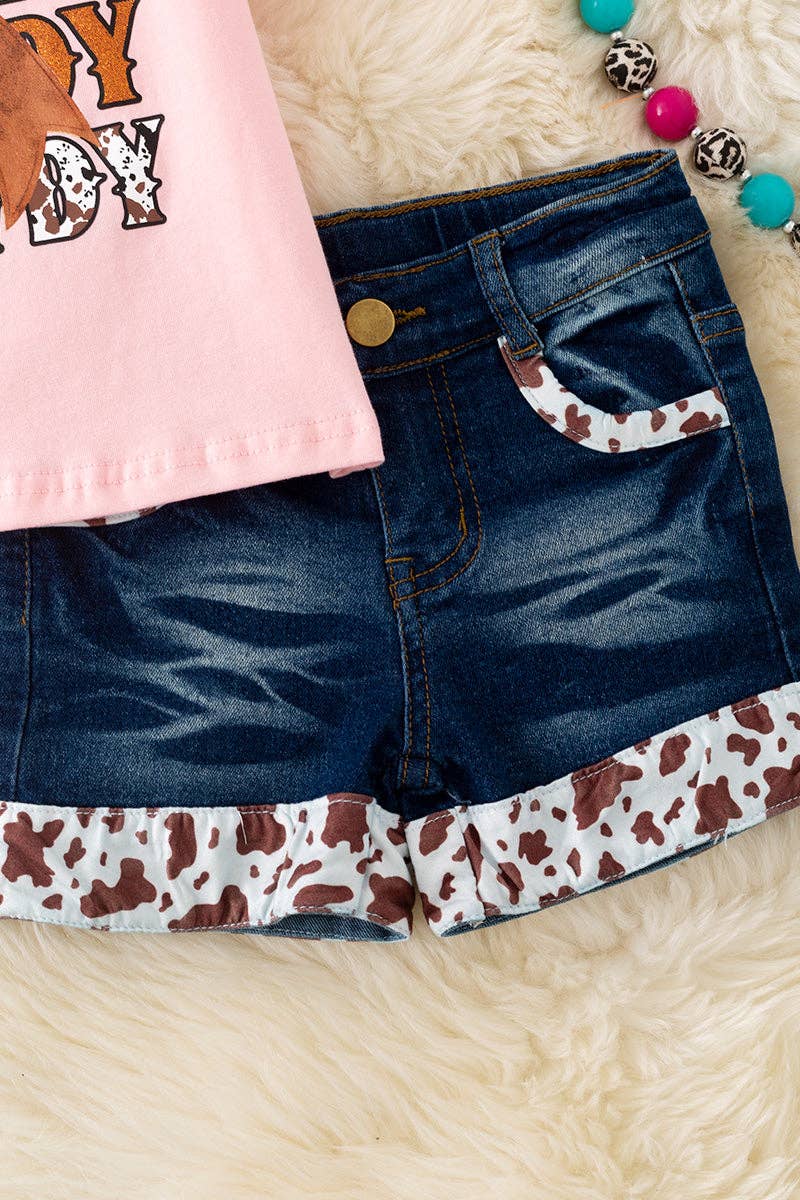 Howdy Howdy" Pink tee and denim shorts.