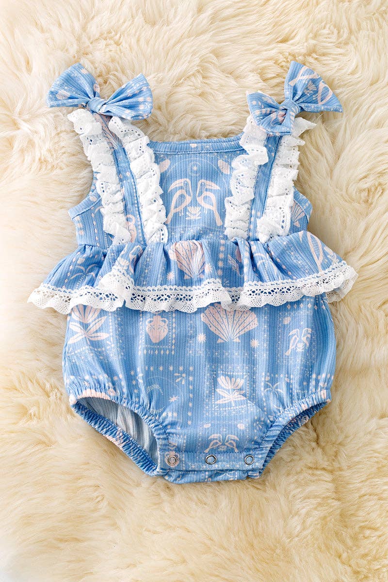 White seashell on blue baby bodysuit w/snaps.