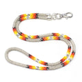 Handmade beaded Silvery southwestern woven lanyard with vibrant red, orange, yellow, black, and white accents.