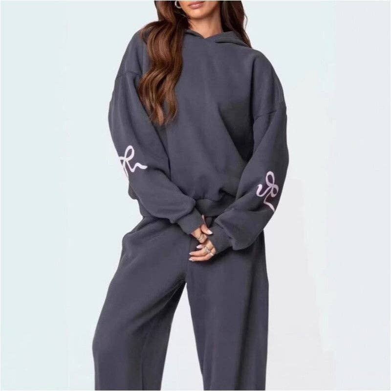 Fleece Hooded Bow Print Sweatsuit featuring cozy brushed fleece fabric in a stylish, coordinated design.