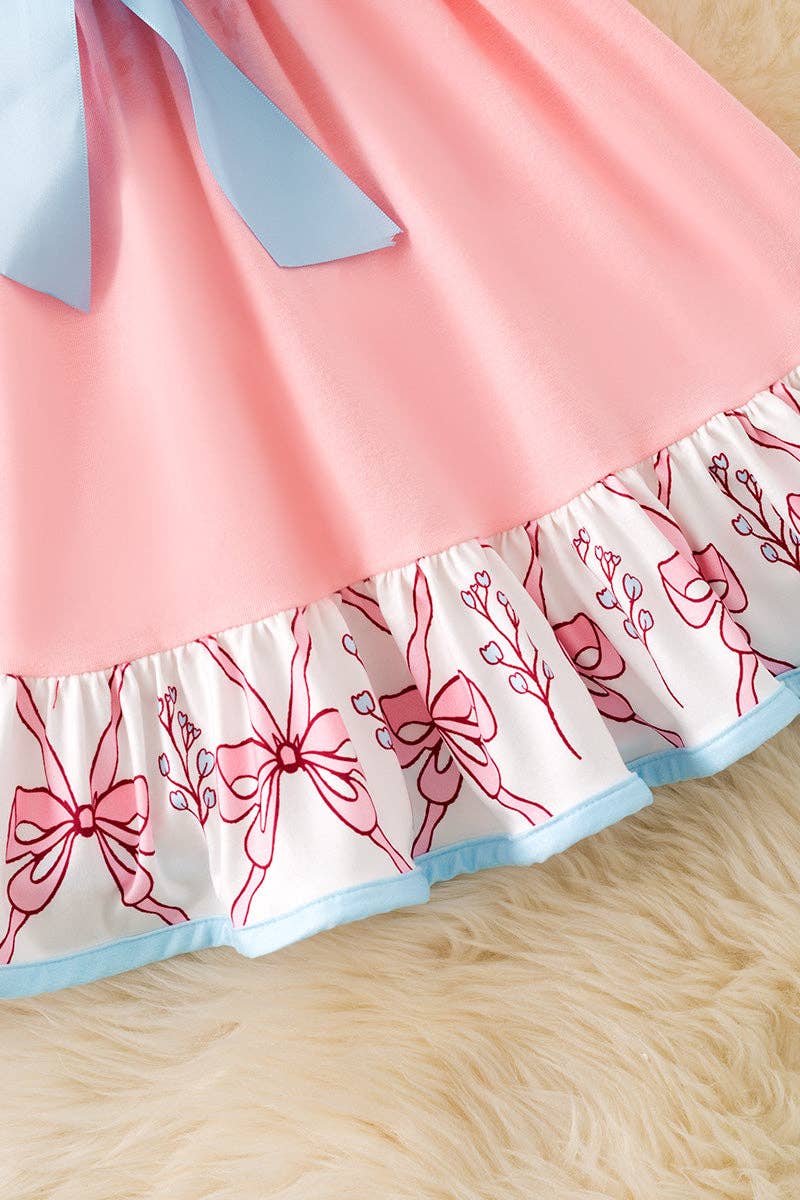 Pink Coquette western ruffle dress with blue front bow.