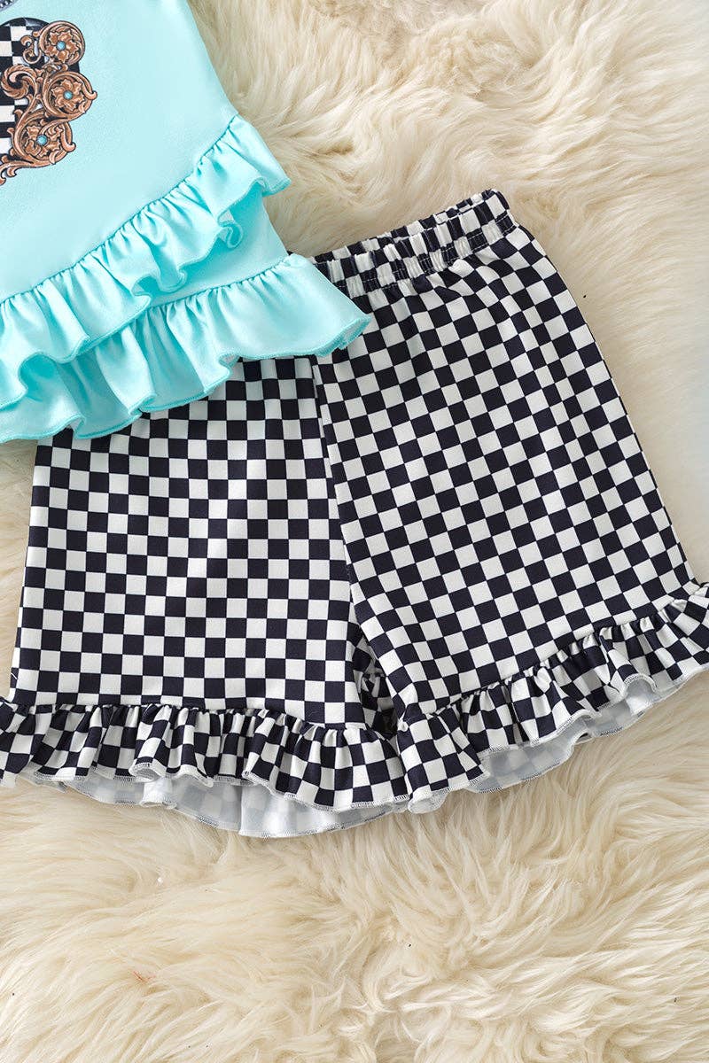 Bull skull on ruffle top and checkered shorts w/ruffle trim.