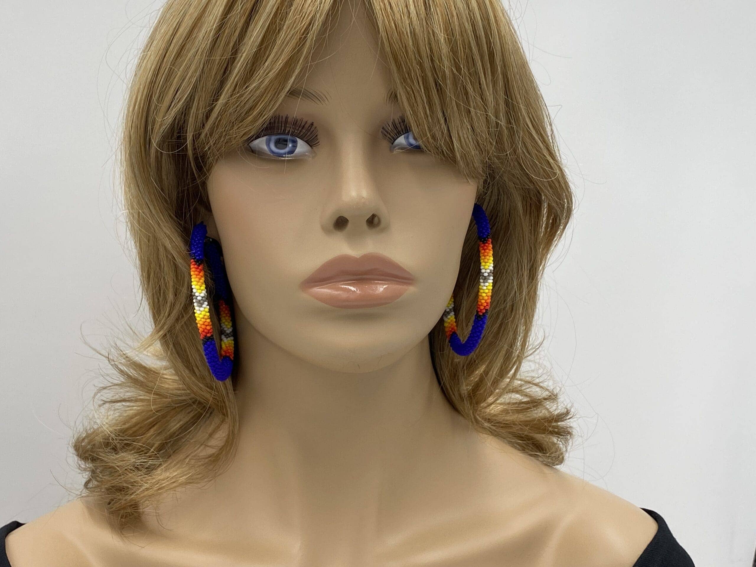 Handmade Native Style 3 Inch Hoop Earrings with Czech Seed Beads - Deep Blue worn by a mannequin, showcasing vibrant colors.