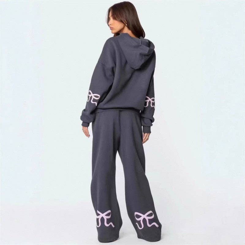 Fleece Hooded Bow Print Sweatsuit featuring a cozy fit with a bow print design, perfect for stylish loungewear.