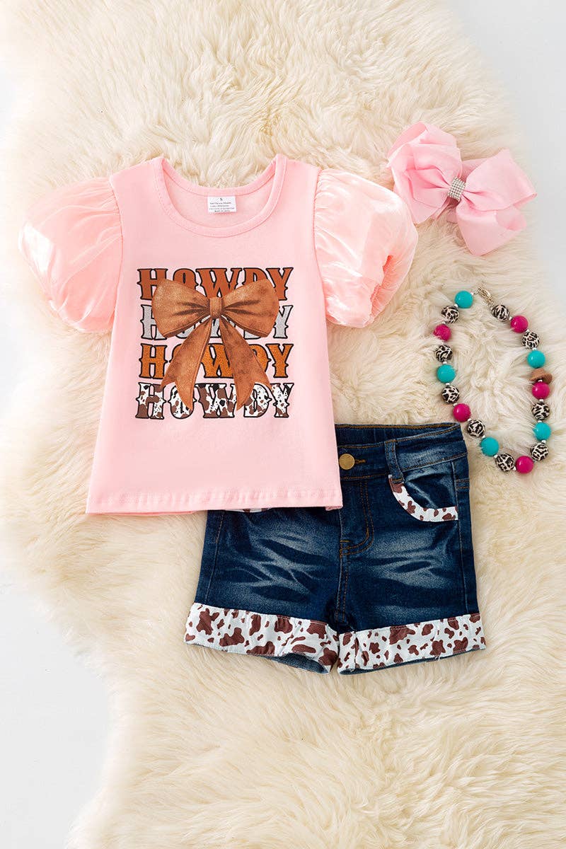 Howdy Howdy" Pink tee and denim shorts.