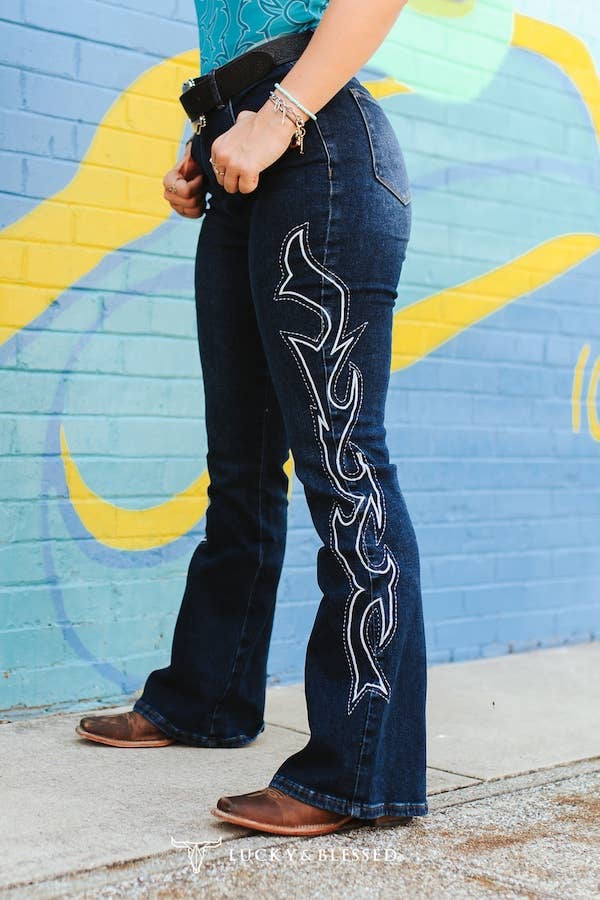 Plus Dark Wash Tummy Control Boot Stitch Embroidery Jeans worn by model showcasing side embroidery detail.