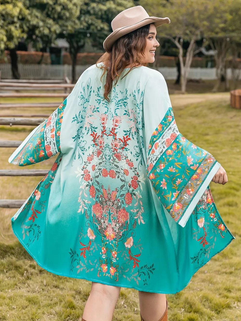 Plus Size Printed Open Front Long Sleeve Cover Up with floral design and long sleeves, perfect for layering and sun protection.
