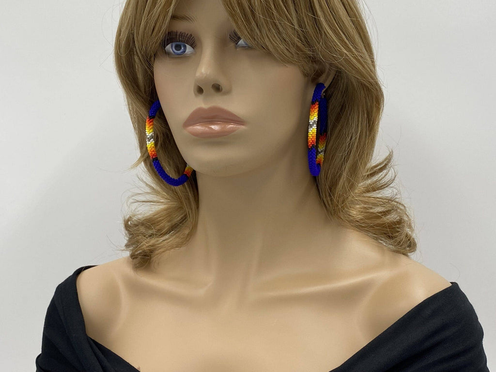 Handmade Native Style 3 Inch Hoop Earrings with Czech Seed Beads - Deep Blue shown on a mannequin model.